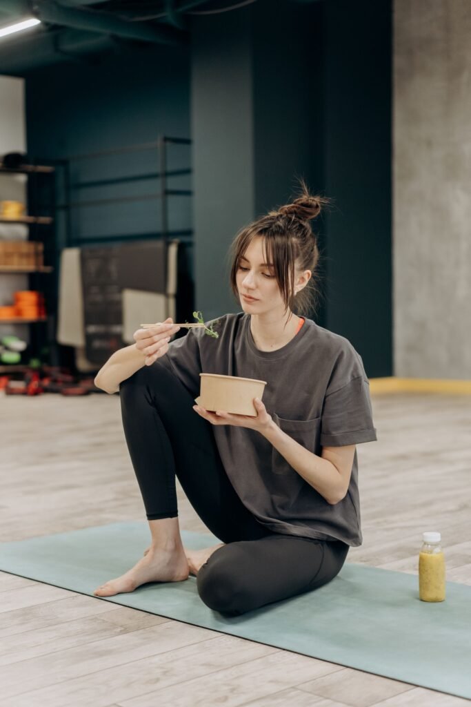 Athlete eating a healthy meal after training for boxing nutrition article